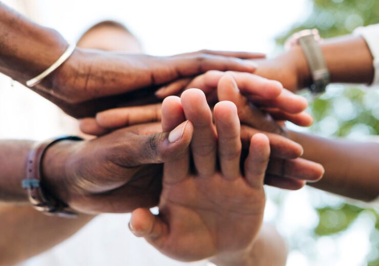 intercultural-hand-shake-outdoor